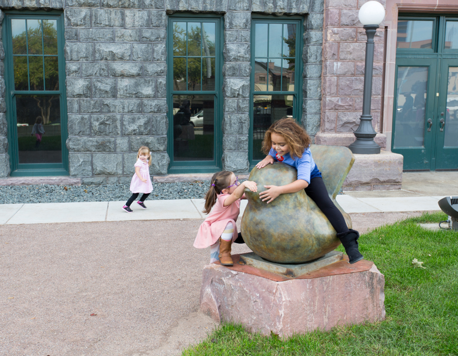 Kids playing in the Paladino Hohm Sculpture Garden