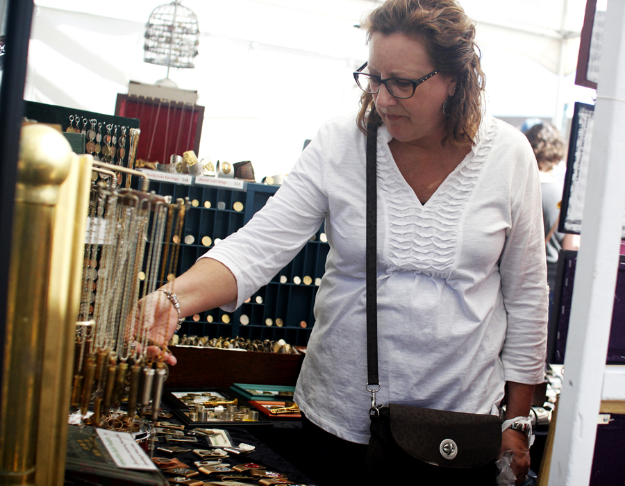 SWAF attendee browsing a jewelry booth
