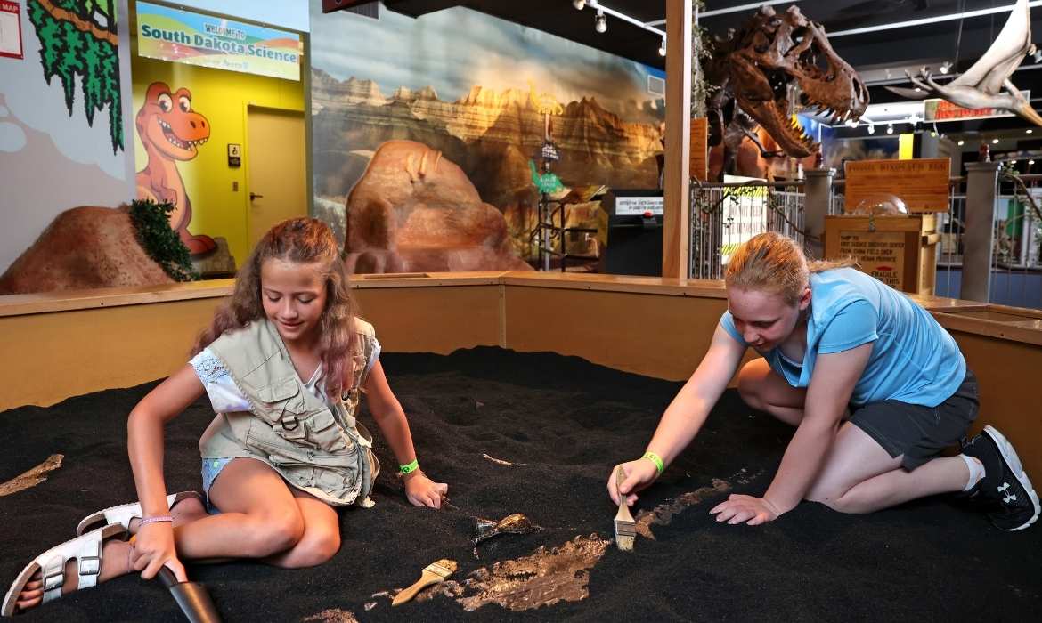 Girls Digging at Dinosaur Discovery