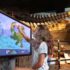 Girl Coloring at Dinosaur Discovery